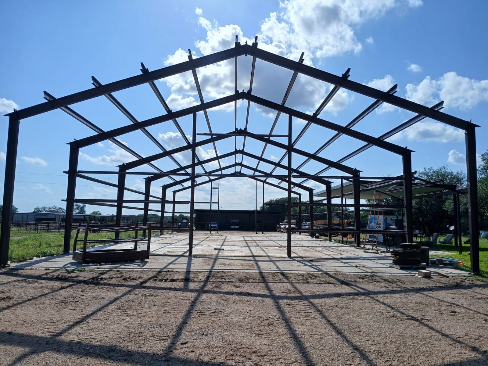 Red iron framing on a Triple J Metal construction site in Central Texas